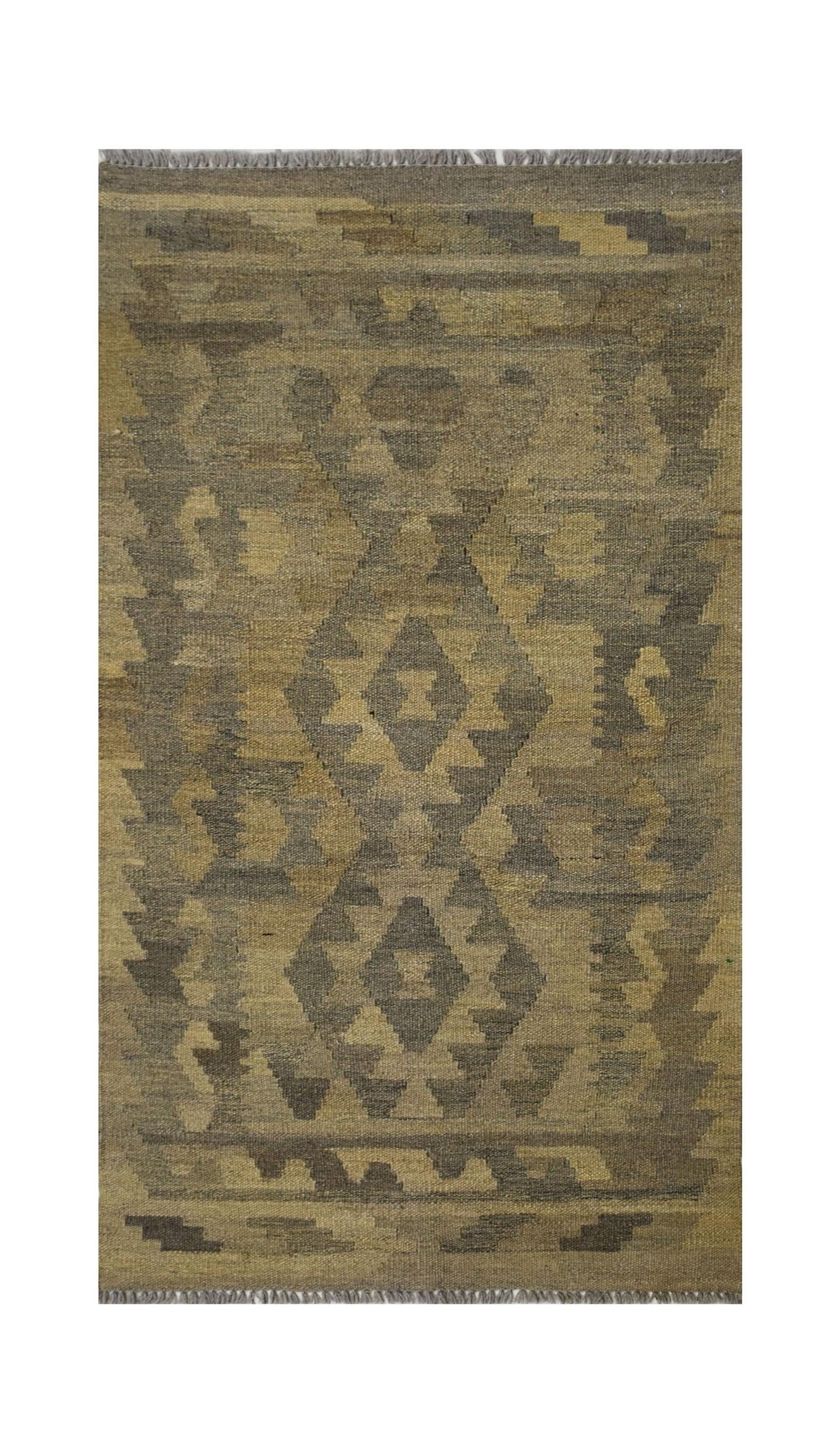 Handmade Afghan Maimana kilim rug featuring a geometric pattern in natural undyed wool tones.