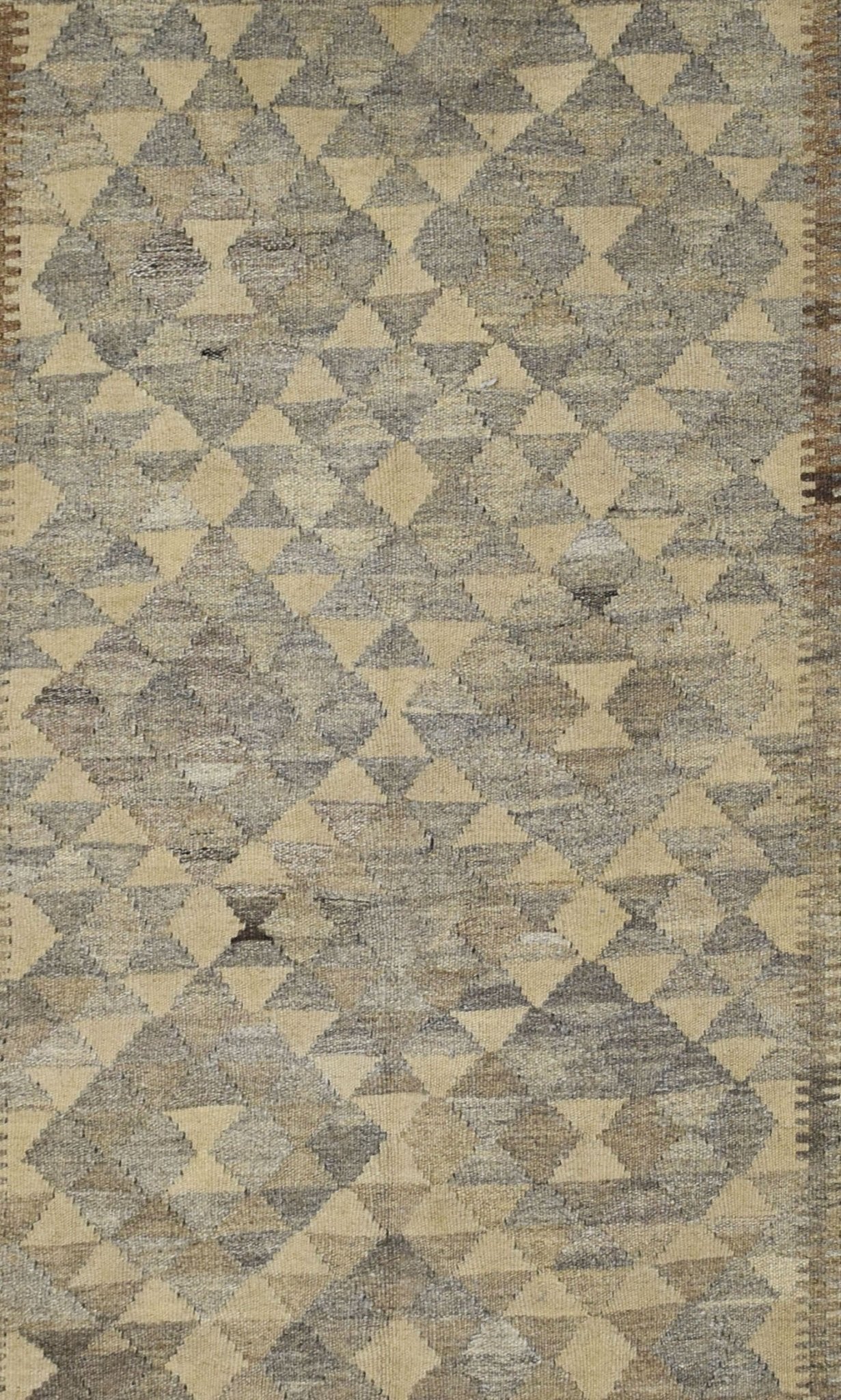 Handmade Afghan Maiamana kilim rug featuring a repeating geometric diamond pattern in natural wool.