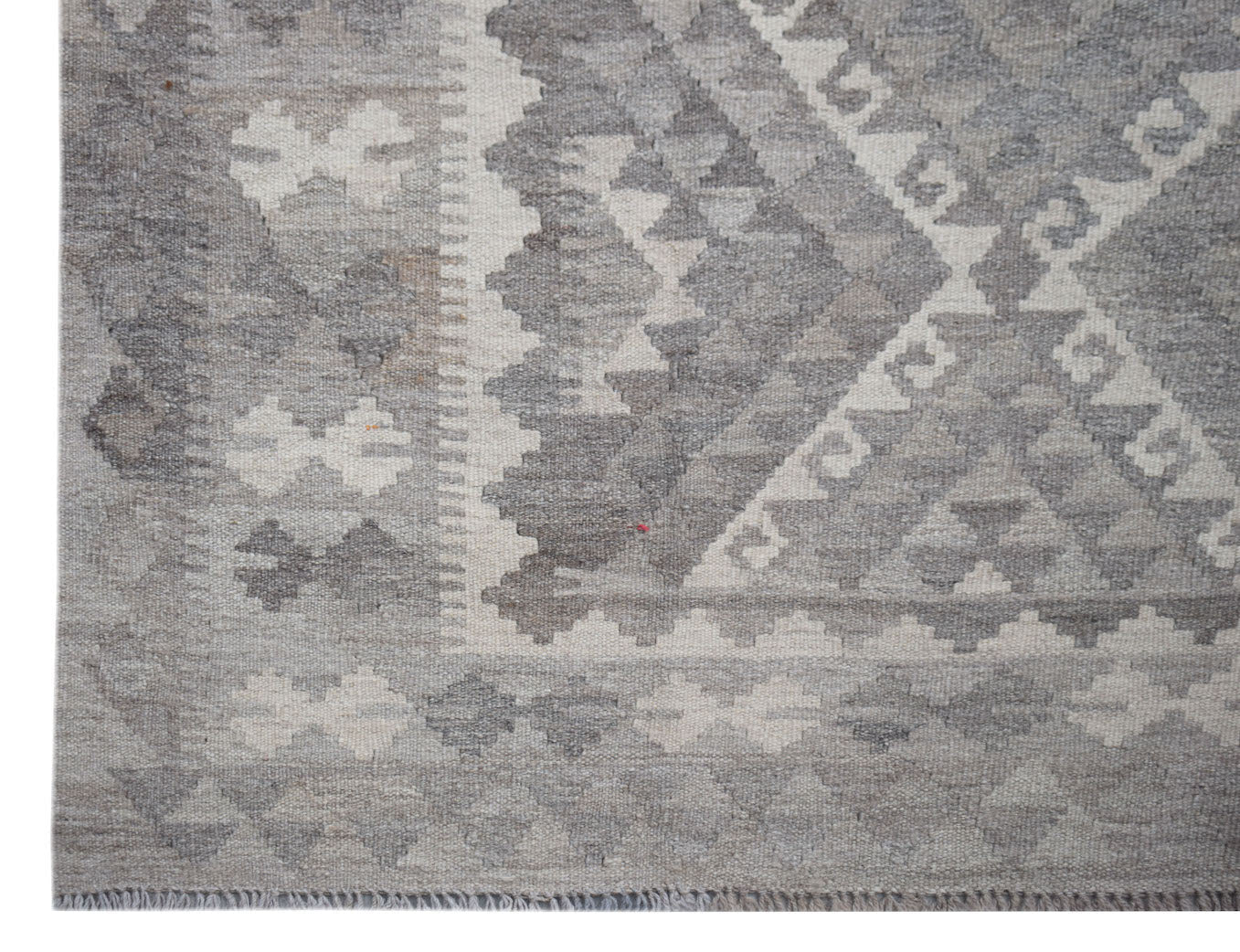 Handwoven Afghan Maimana kilim rug featuring a geometric pattern in shades of grey and cream.