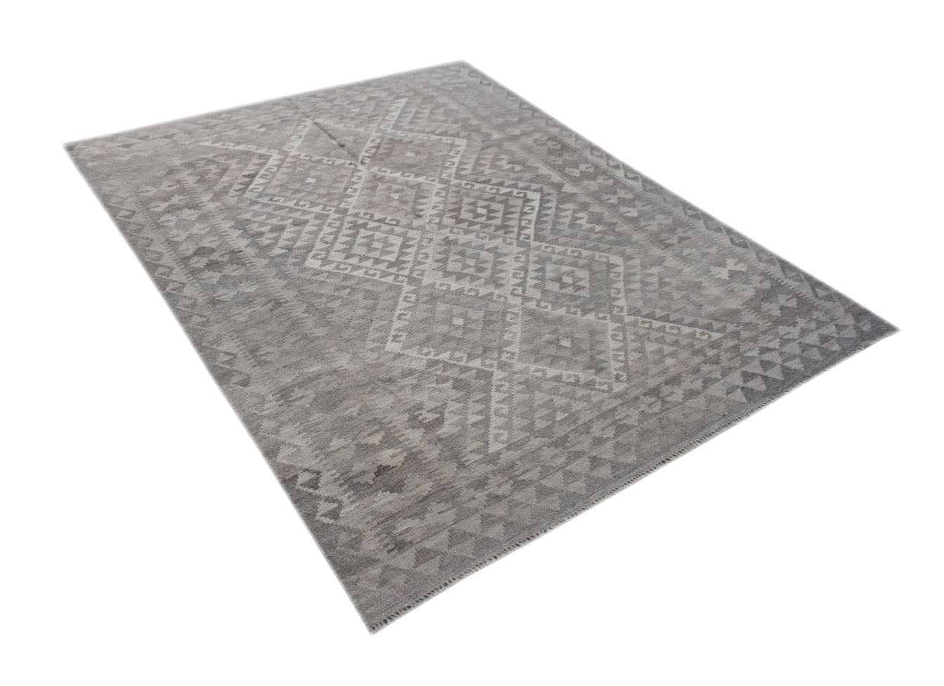 A rectangular, handwoven Afghan Kilim rug featuring a grey geometric pattern on natural wool.