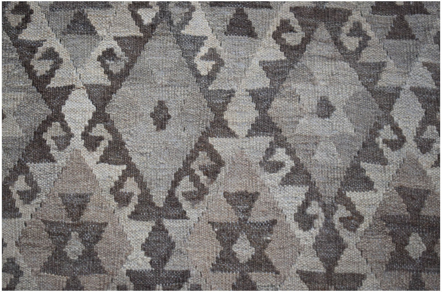 Handwoven Afghan Maimana kilim rug featuring a neutral-toned geometric diamond pattern.