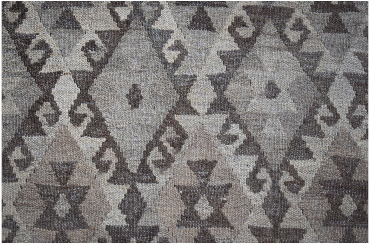 Handwoven Afghan Maimana kilim rug featuring a neutral-toned geometric diamond pattern.