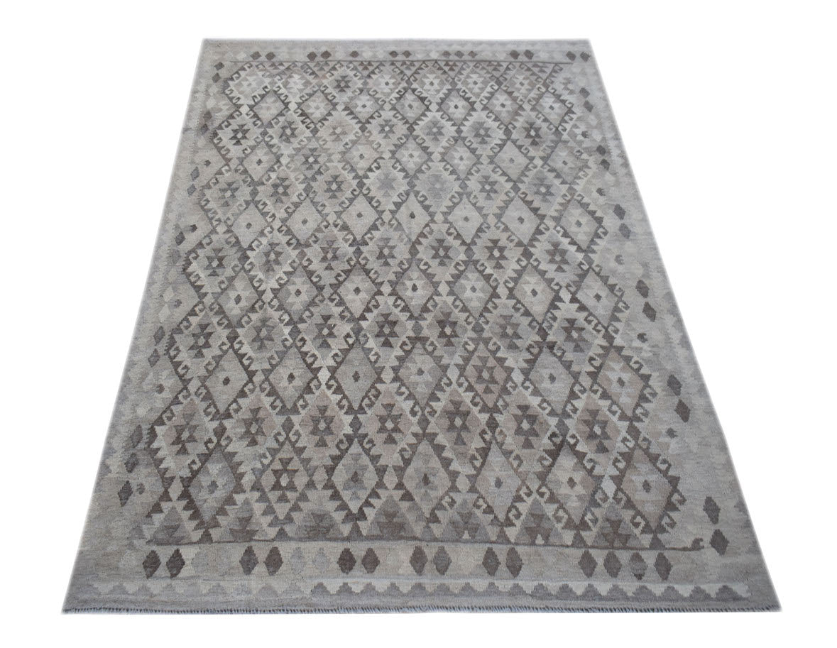 A handmade Afghan Maimana kilim rug featuring a grey and beige geometric diamond pattern.