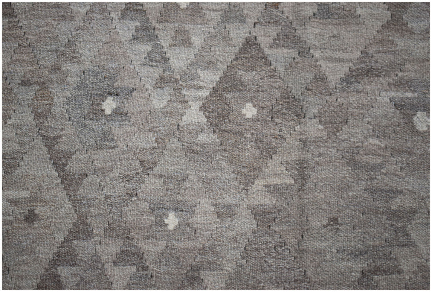 Handwoven Afghan Maimana kilim rug featuring a neutral-toned geometric diamond pattern.