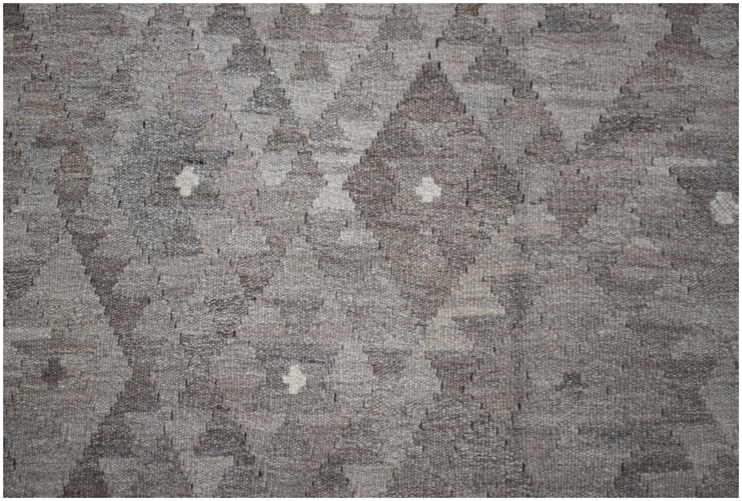 Handwoven Afghan Maimana kilim rug featuring a neutral-toned geometric diamond pattern.