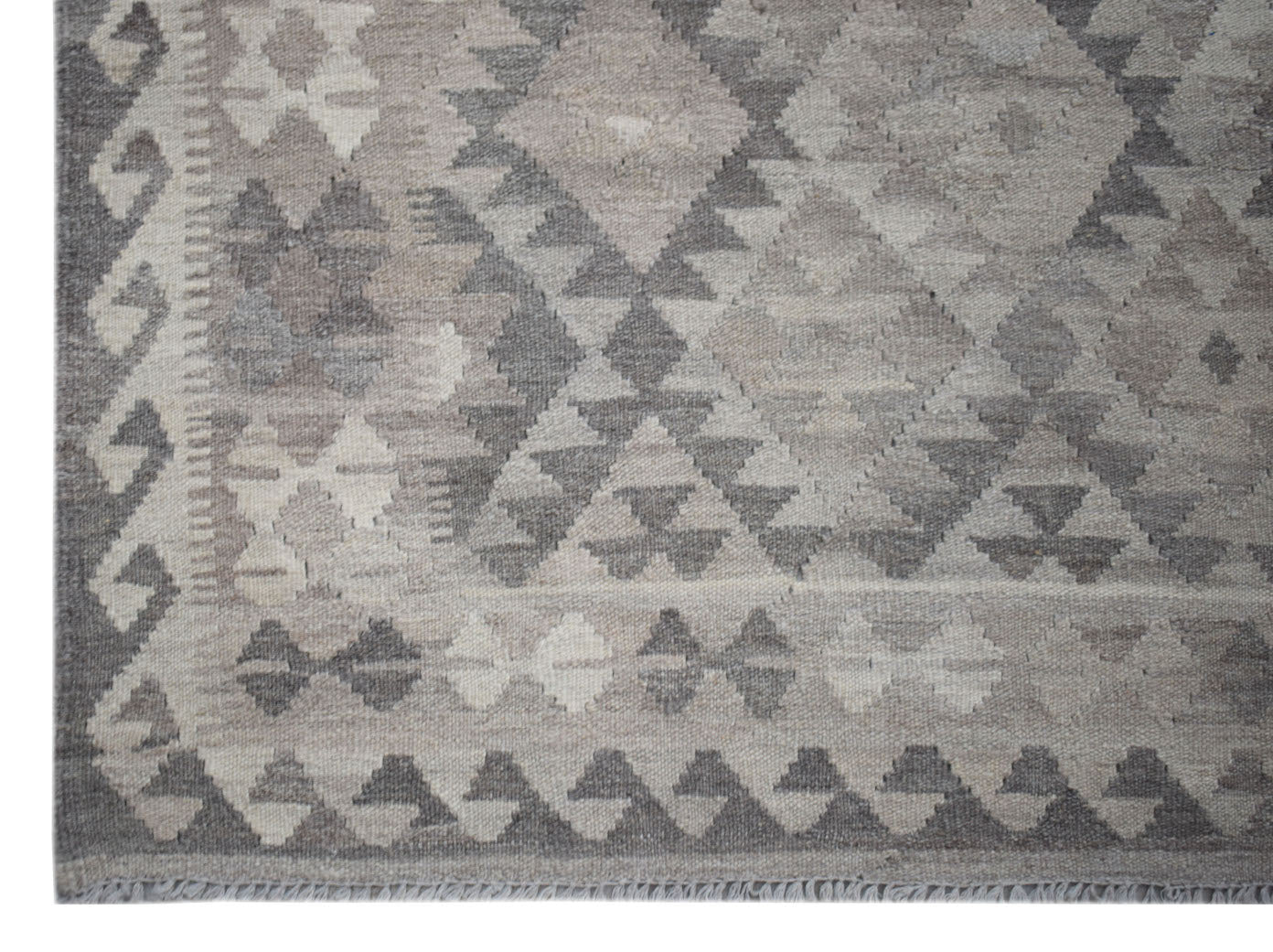 Handwoven Afghan Maimana kilim rug featuring a grey geometric diamond pattern in natural wool.