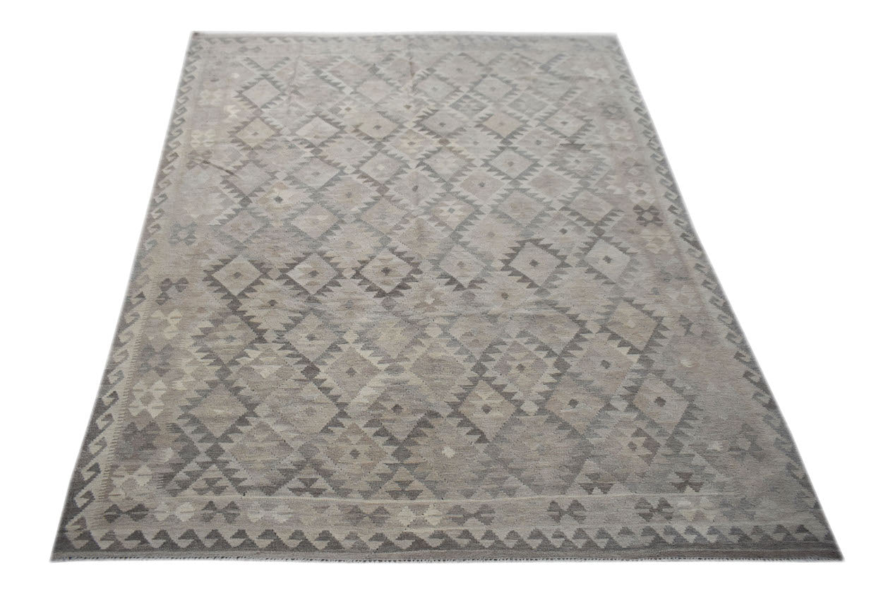 A handmade Afghan Maimana kilim rug featuring a neutral grey geometric diamond pattern.