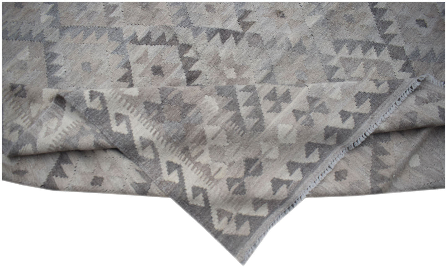 Handwoven Afghan Maiamana kilim featuring a neutral grey geometric pattern in natural wool.