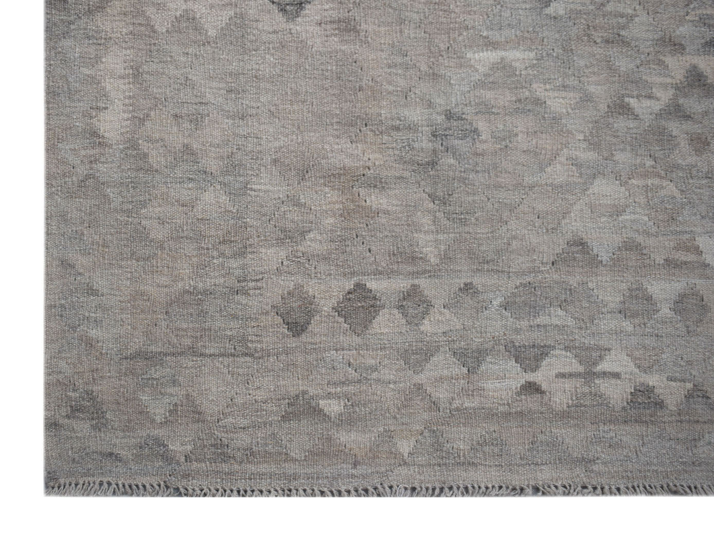 Handwoven Afghan Maimana kilim rug featuring a neutral grey geometric pattern in natural wool.