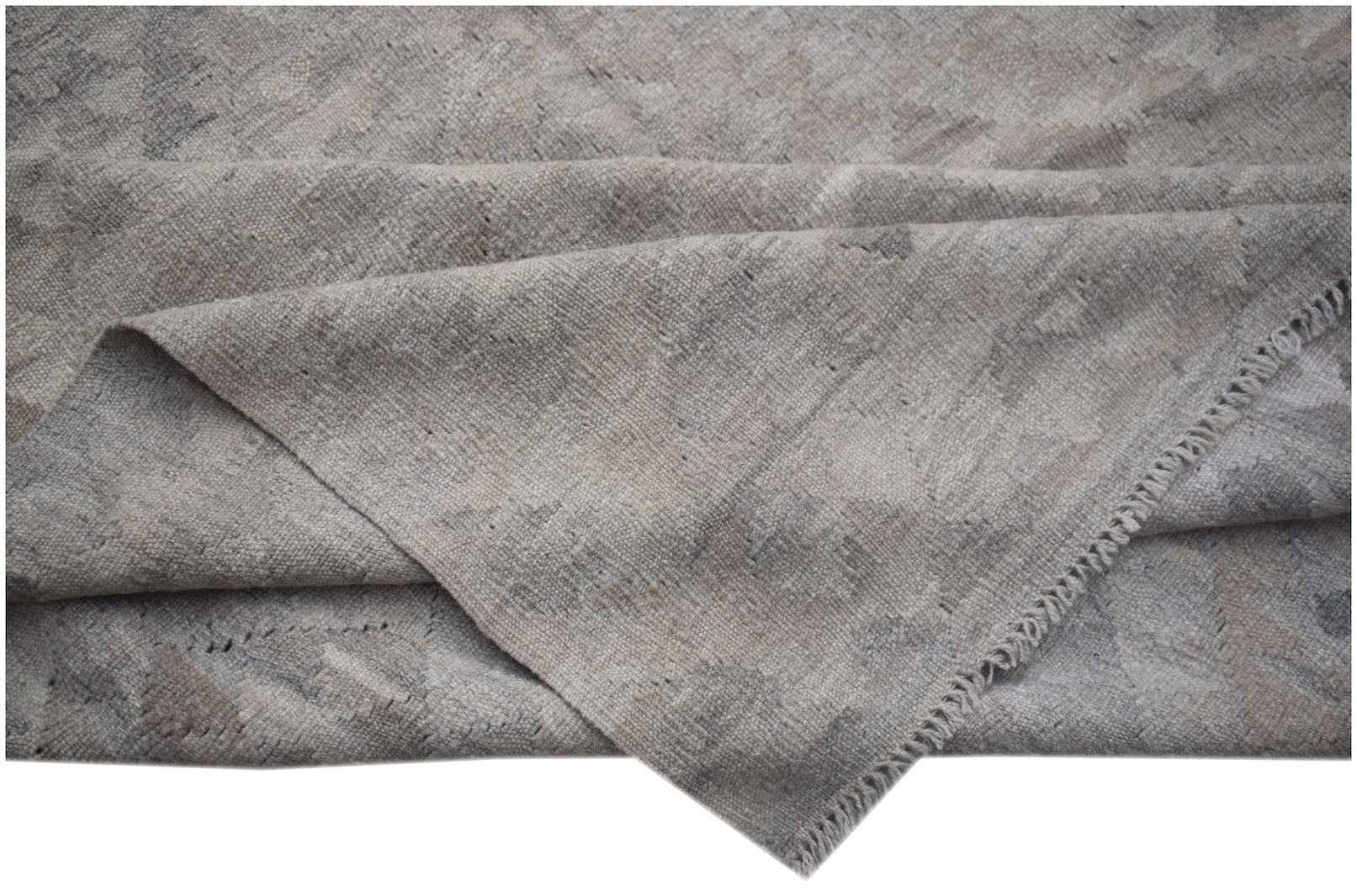 A handwoven Afghan Maiamana kilim featuring a neutral, undyed wool pattern with a flat texture.
