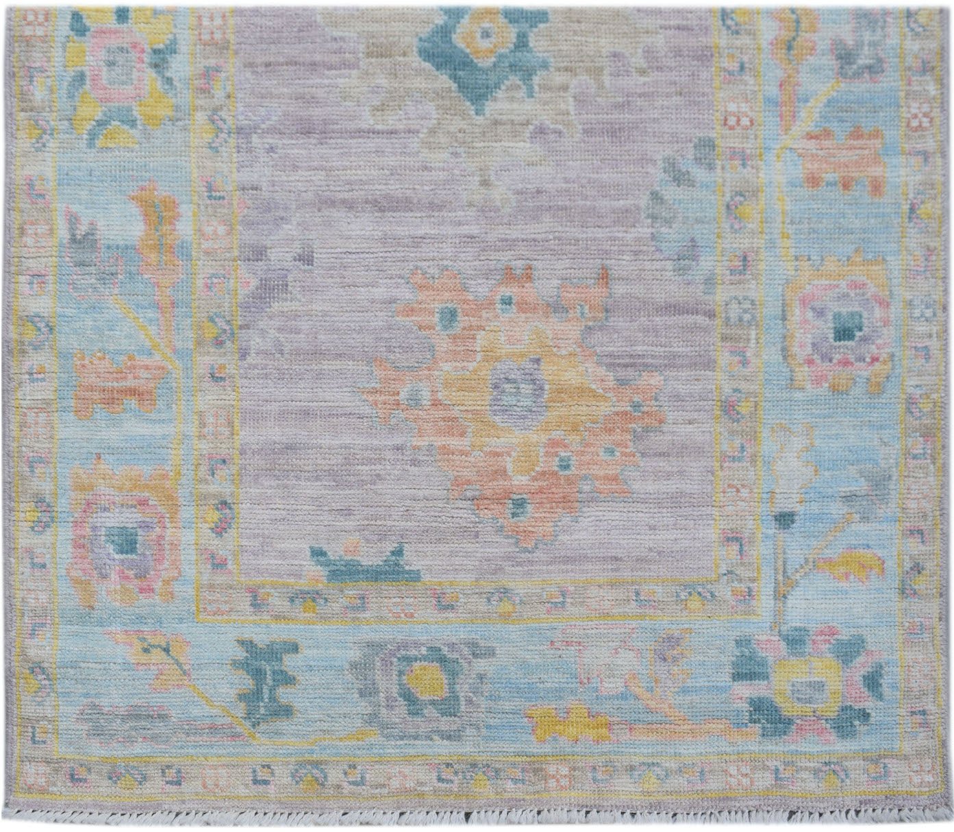 A handmade Afghan Oushak runner featuring a traditional floral pattern in soft pastel tones.