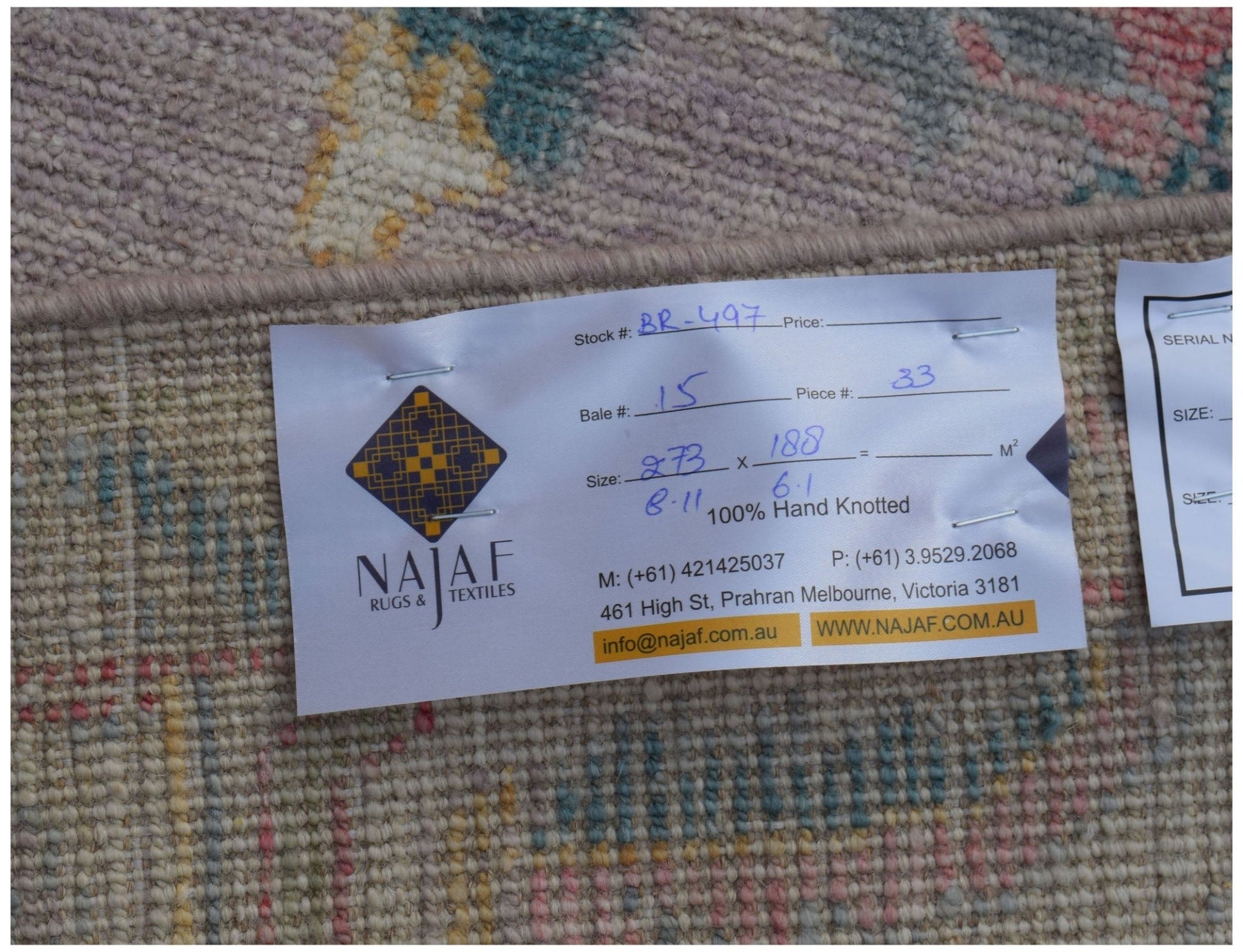 A handmade transitional Oushak rug featuring a traditional pattern in a unique color palette.