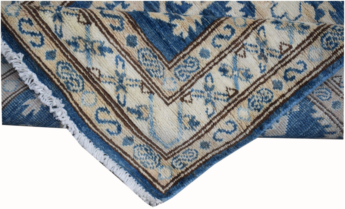 A handmade Afghan Super Kazakh runner featuring traditional blue and cream geometric patterns.