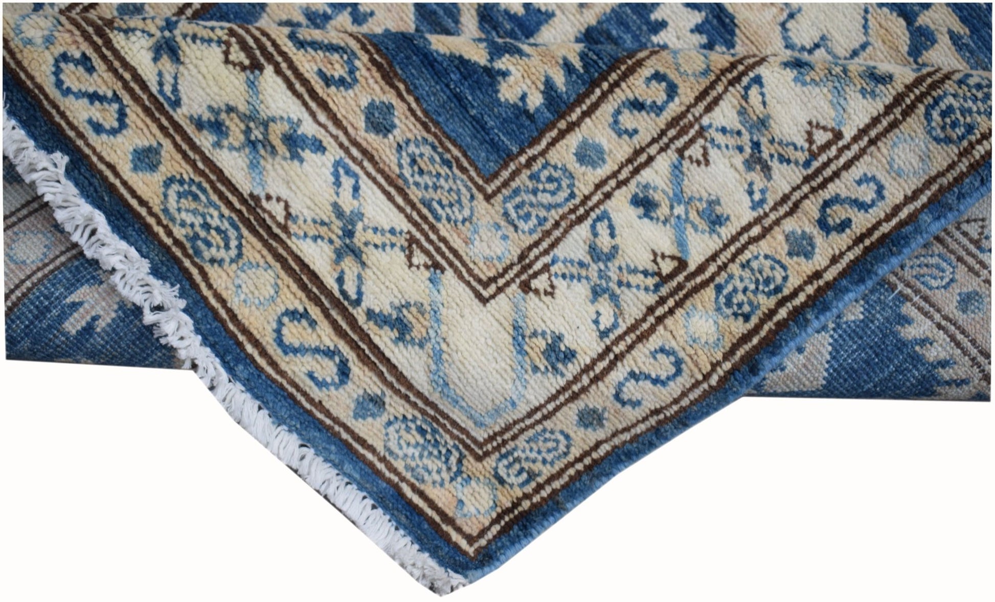 A handmade Afghan Super Kazakh runner featuring traditional blue and cream geometric patterns.
