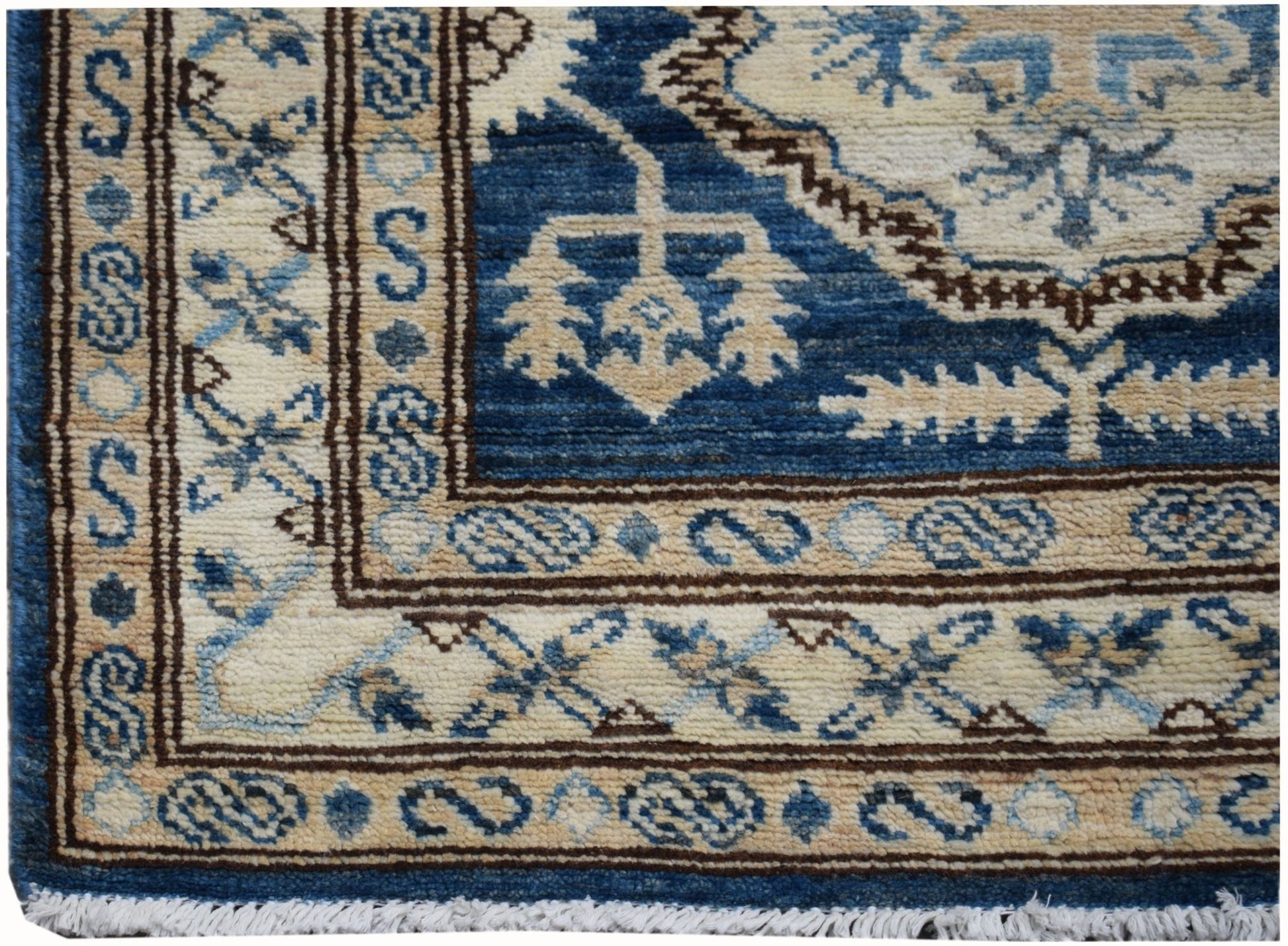 A handmade Afghan Super Kazakh runner featuring traditional blue and cream geometric patterns.