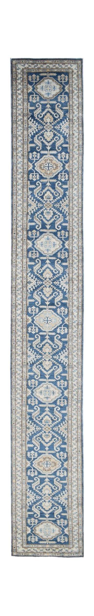 A long, handmade Afghan Super Kazakh runner rug featuring traditional geometric motifs in blue.