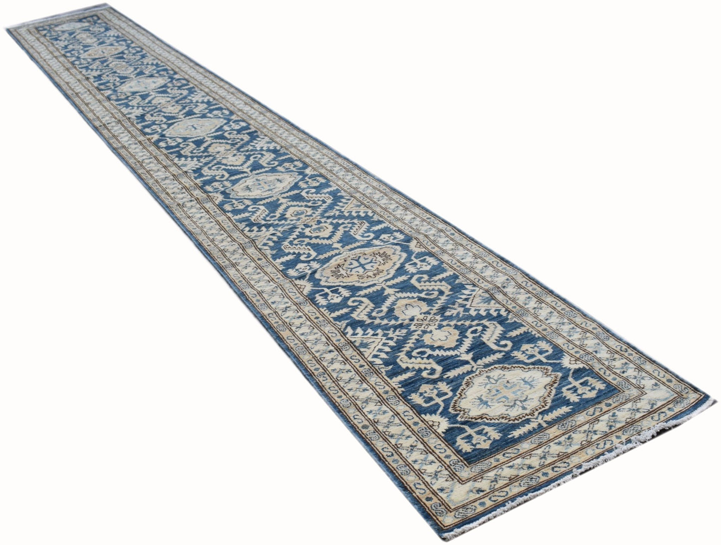 A long, handmade Afghan Super Kazakh runner rug featuring traditional blue and cream geometric motifs.