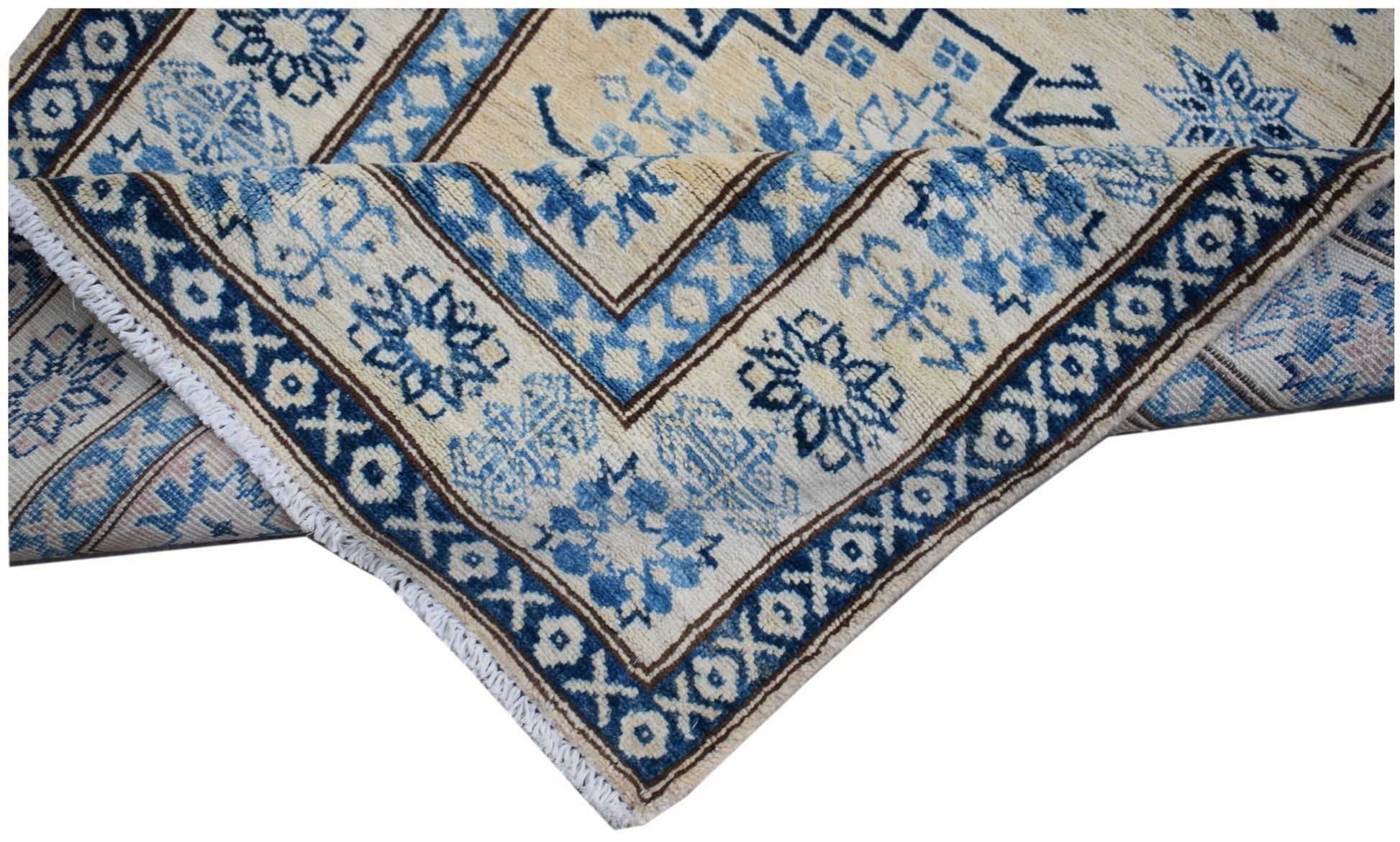 An Afghan Super Kazakh runner rug featuring traditional blue geometric patterns on a cream base.