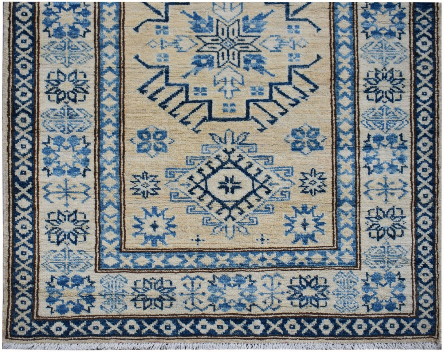 Handmade Afghan Super Kazakh runner rug featuring traditional blue geometric motifs on a beige base.