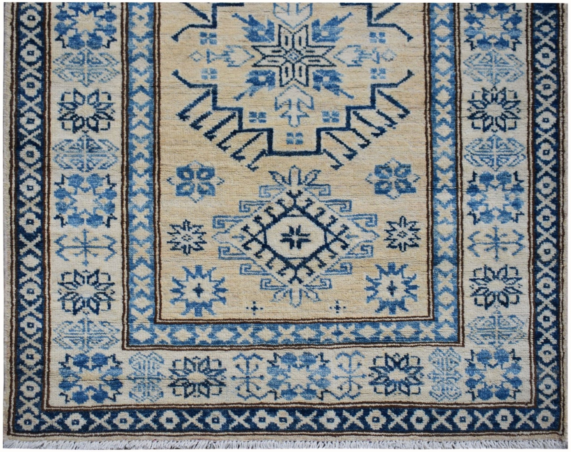 Handmade Afghan Super Kazakh runner rug featuring traditional blue geometric motifs on a beige base.