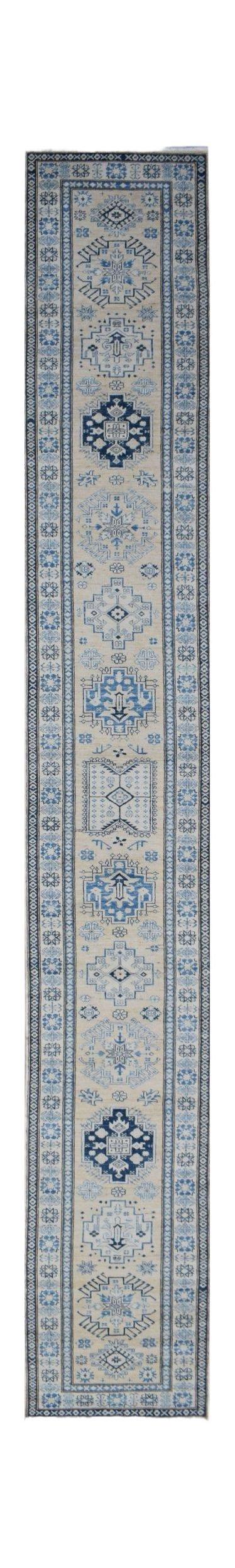 A long, handmade Afghan Super Kazakh runner rug featuring traditional blue geometric motifs.