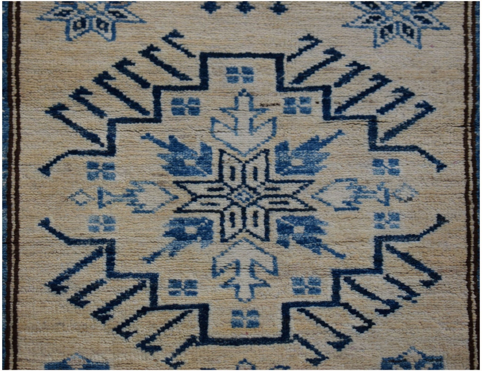 Handmade Afghan Super Kazakh runner rug featuring a traditional blue geometric medallion pattern.