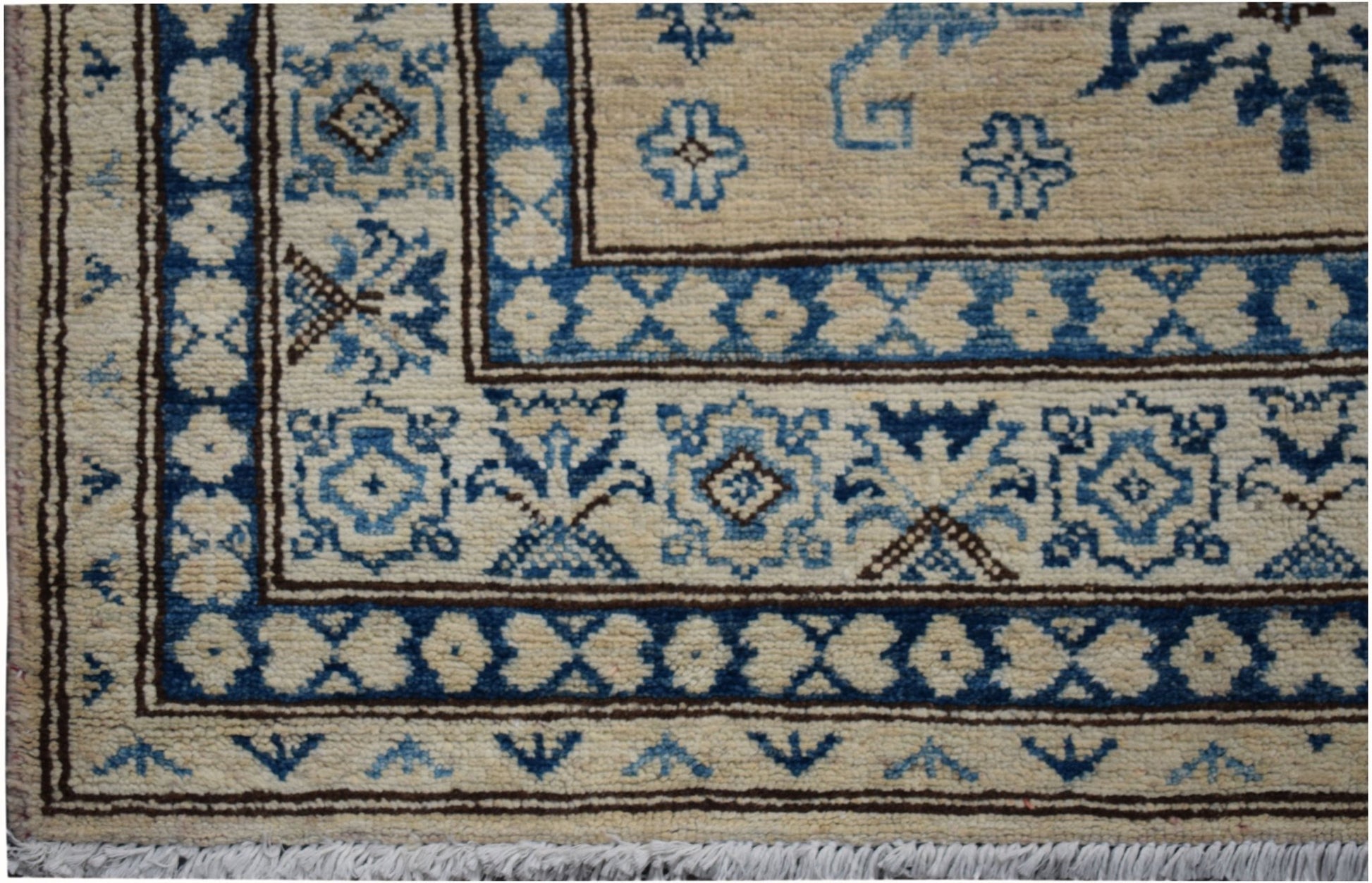 Handmade Afghan Super Kazakh runner featuring traditional blue and cream geometric patterns.