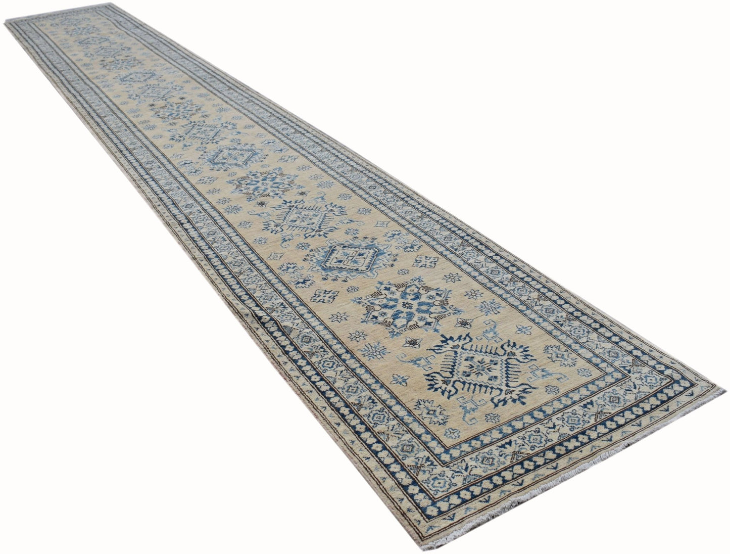 A long, handmade Afghan Super Kazakh runner rug featuring traditional blue geometric motifs.