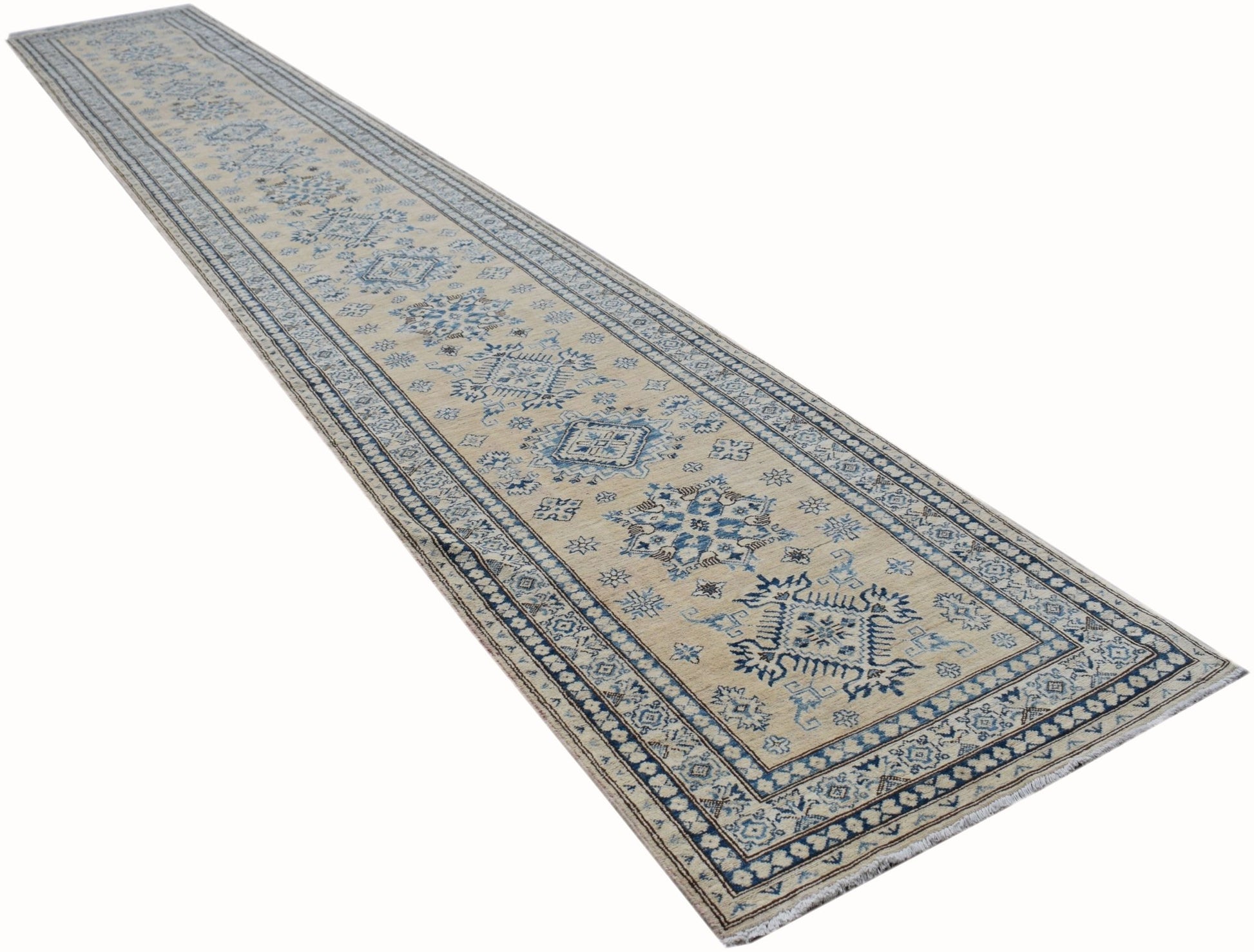 A long, handmade Afghan Super Kazakh runner rug featuring traditional blue geometric motifs.