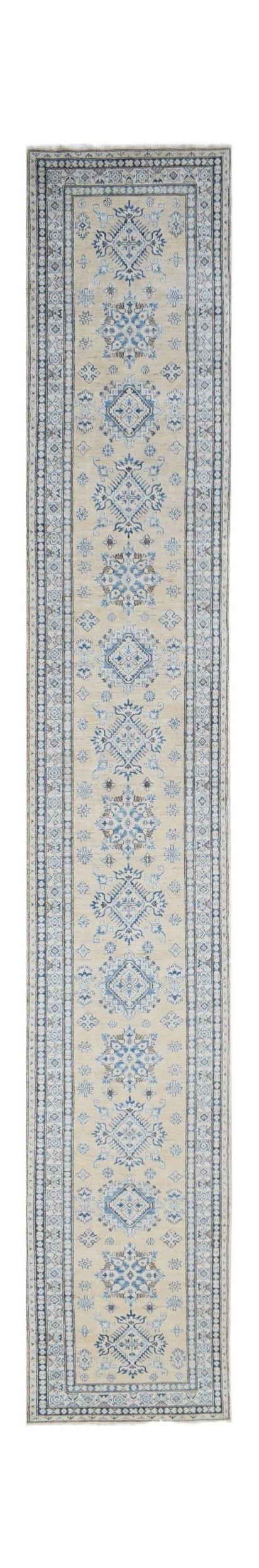 A long, handmade Afghan runner rug featuring traditional blue geometric motifs on a beige field.