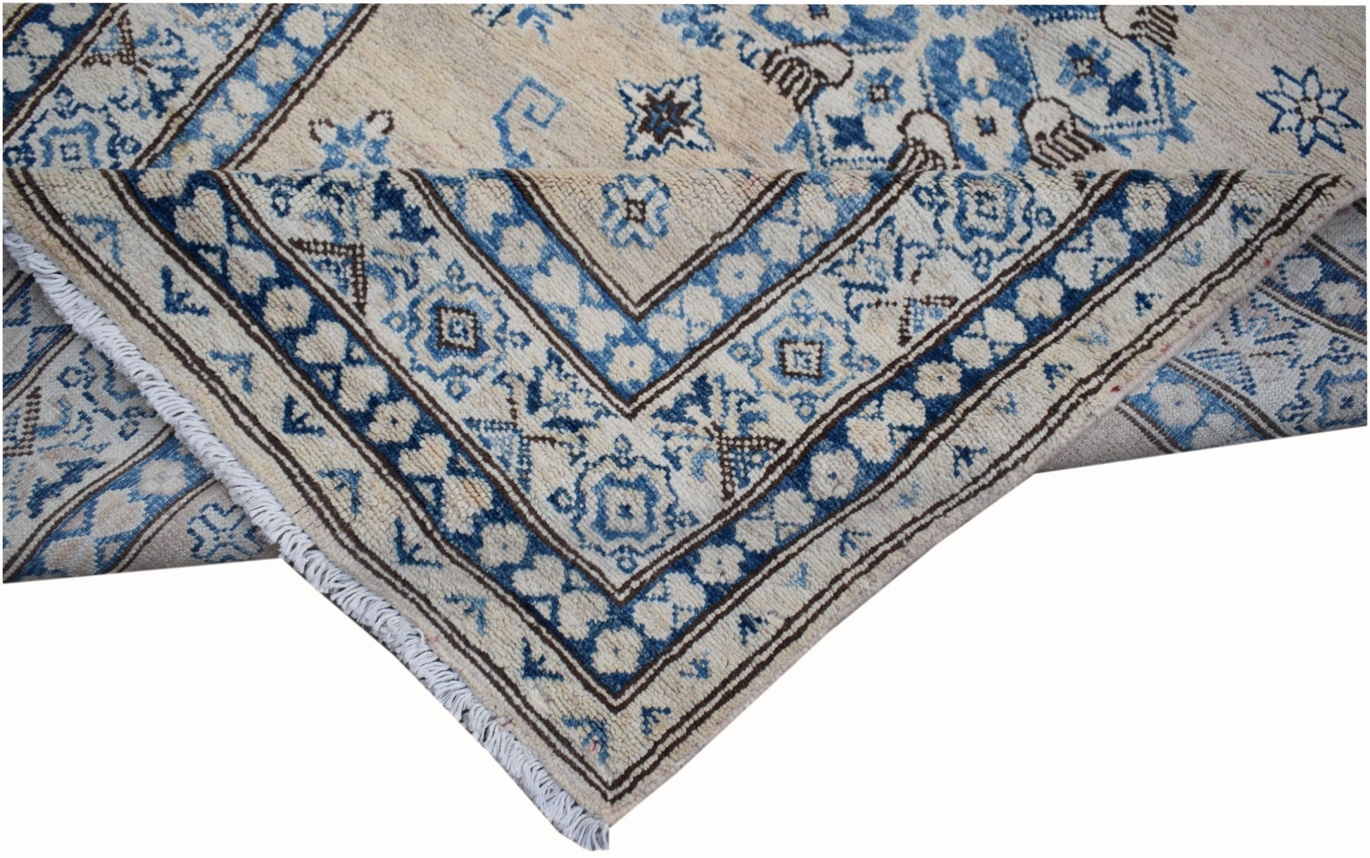 A handmade Afghan Super Kazakh runner featuring traditional blue and cream geometric patterns.