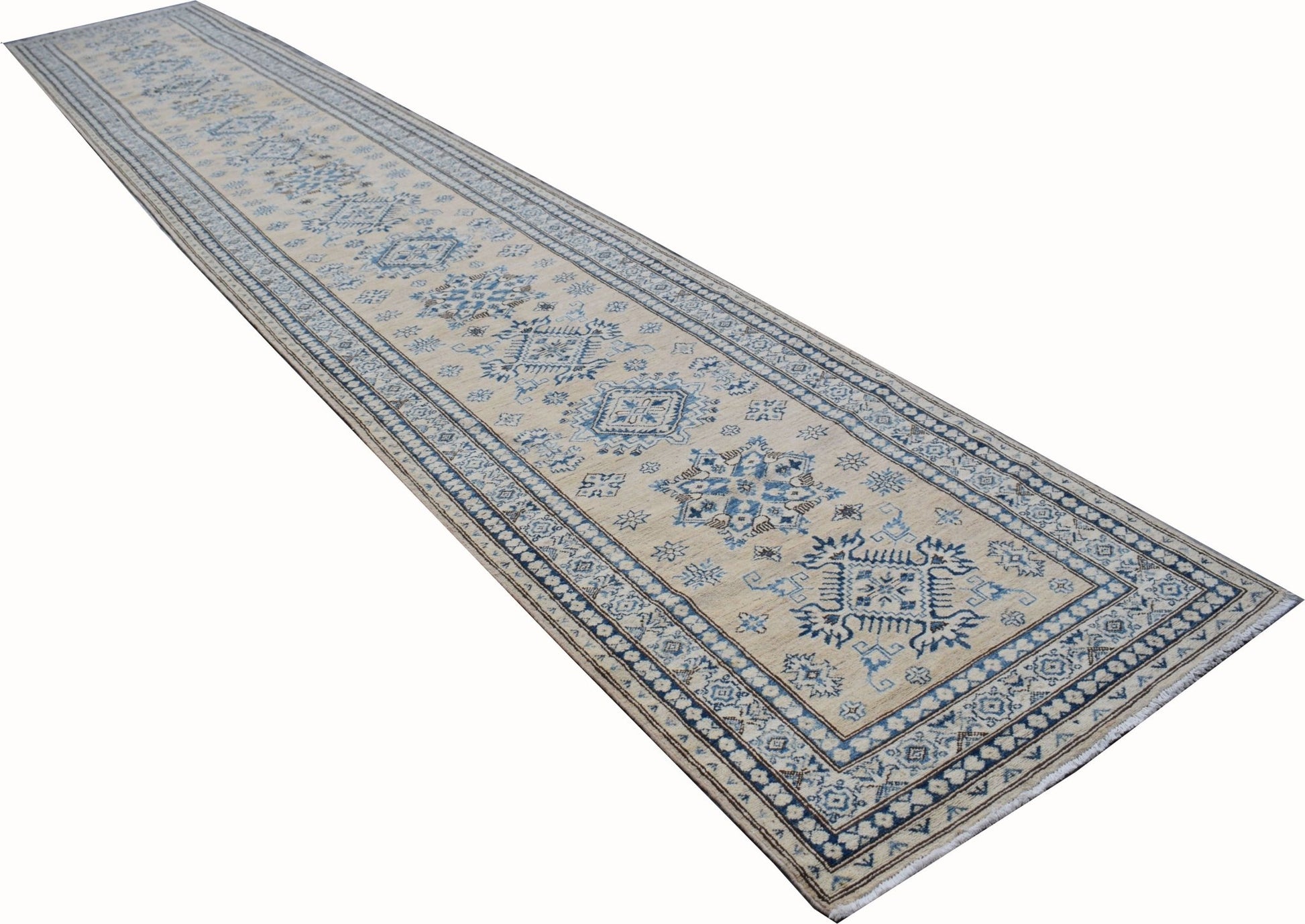 An Afghan Super Kazakh runner rug featuring traditional blue geometric motifs on a beige field.