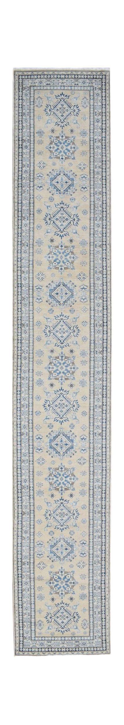 A handmade Afghan Super Kazakh runner rug featuring traditional blue geometric motifs on a beige base.