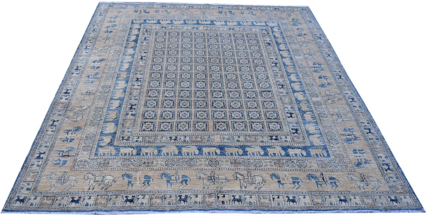 Handmade Afghan Chobi rug featuring a Pazyryk-inspired grid pattern with blue and beige motifs.