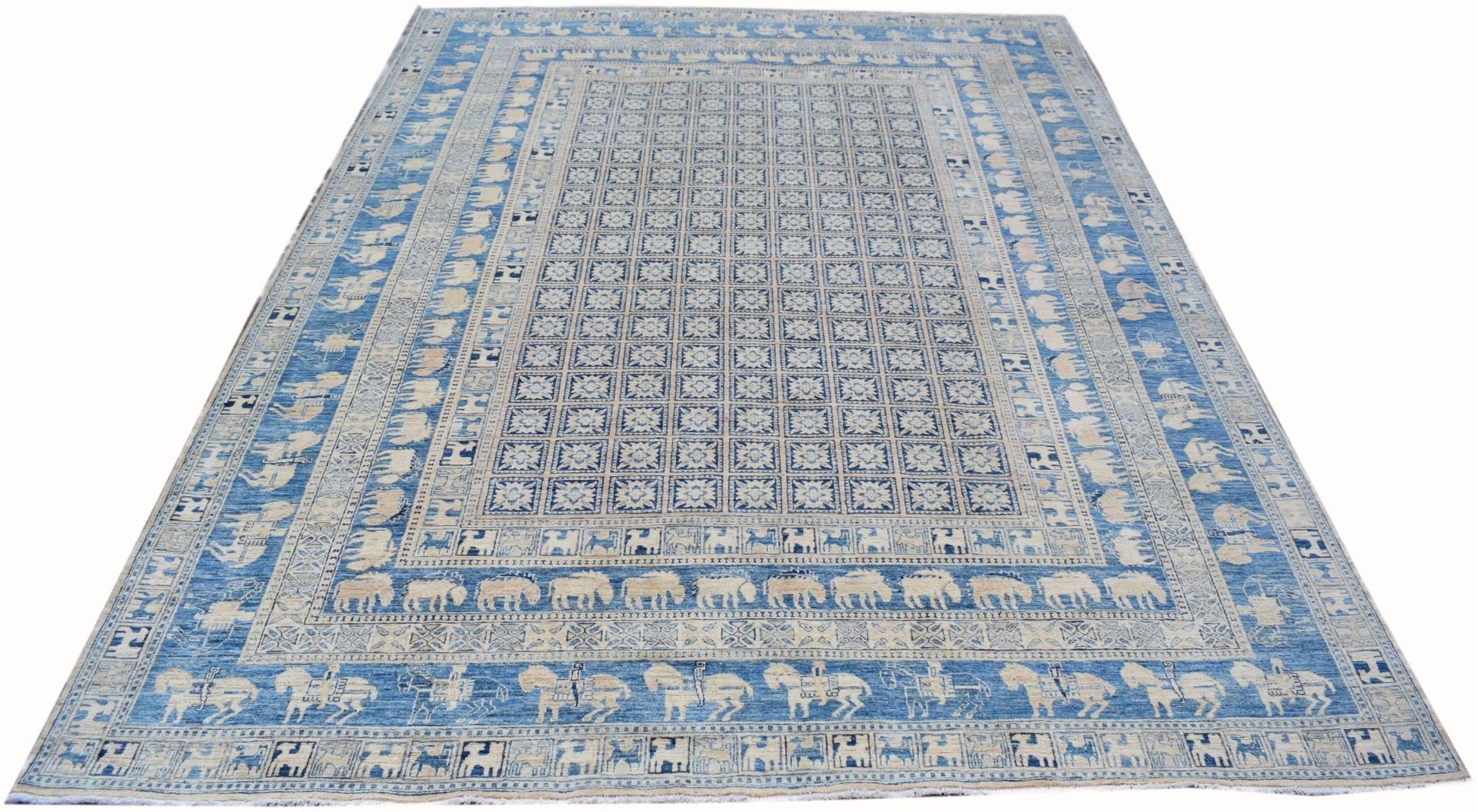 An Afghan Chobi rug featuring a blue field with a grid of floral motifs and animal border patterns.