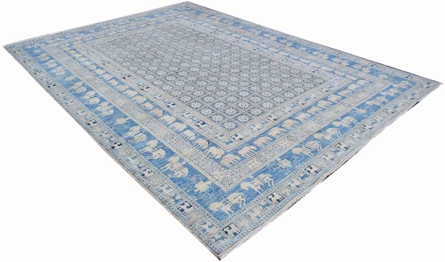 A rectangular Afghan Chobi rug featuring a blue and cream geometric pattern with animal motifs.
