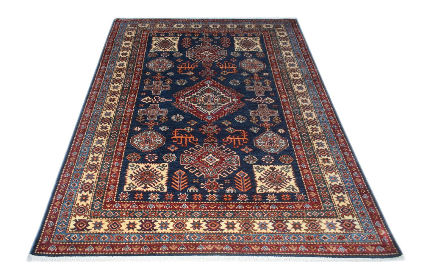 A rectangular Afghan Super Kazakh rug featuring traditional geometric motifs on a navy blue field.