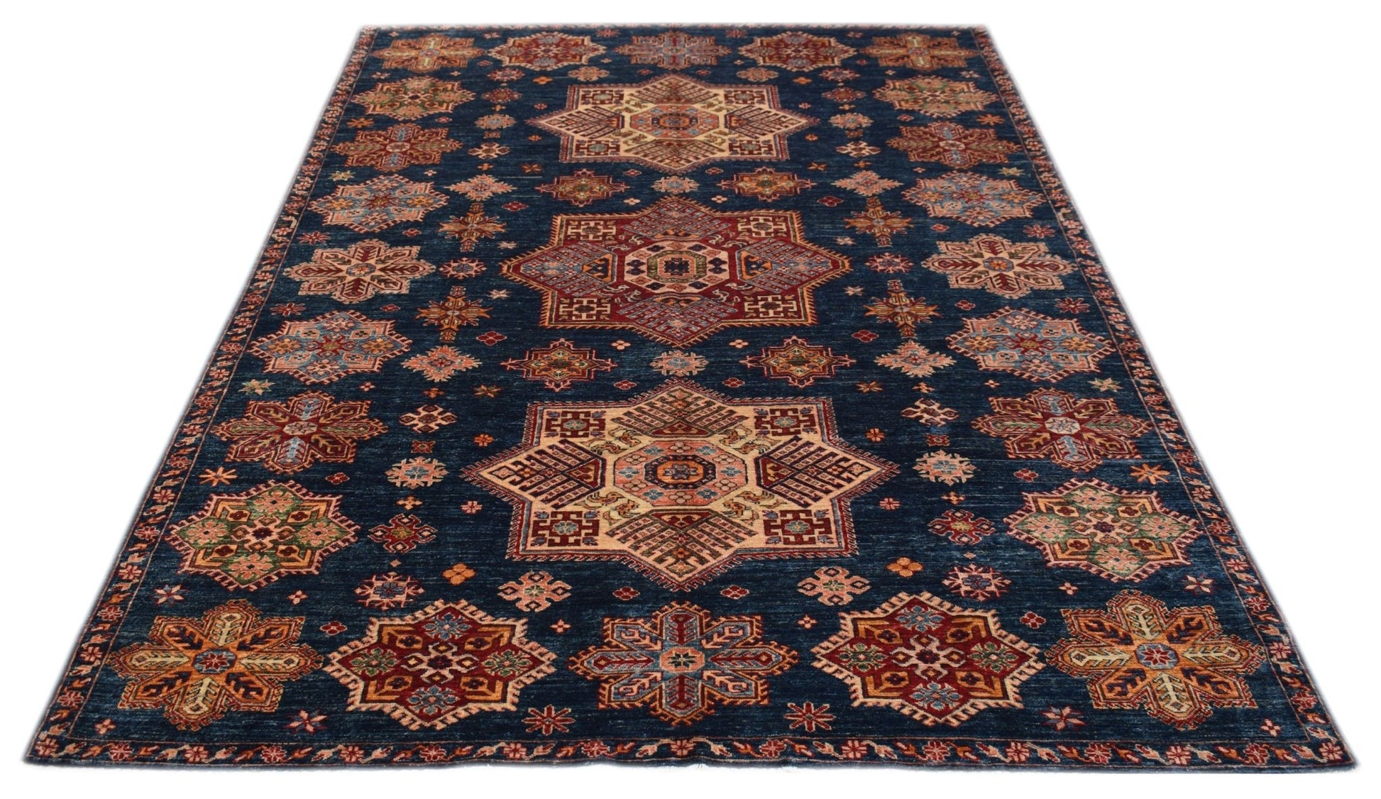Handmade Afghan Super Kazakh rug featuring traditional geometric motifs on a deep blue background.