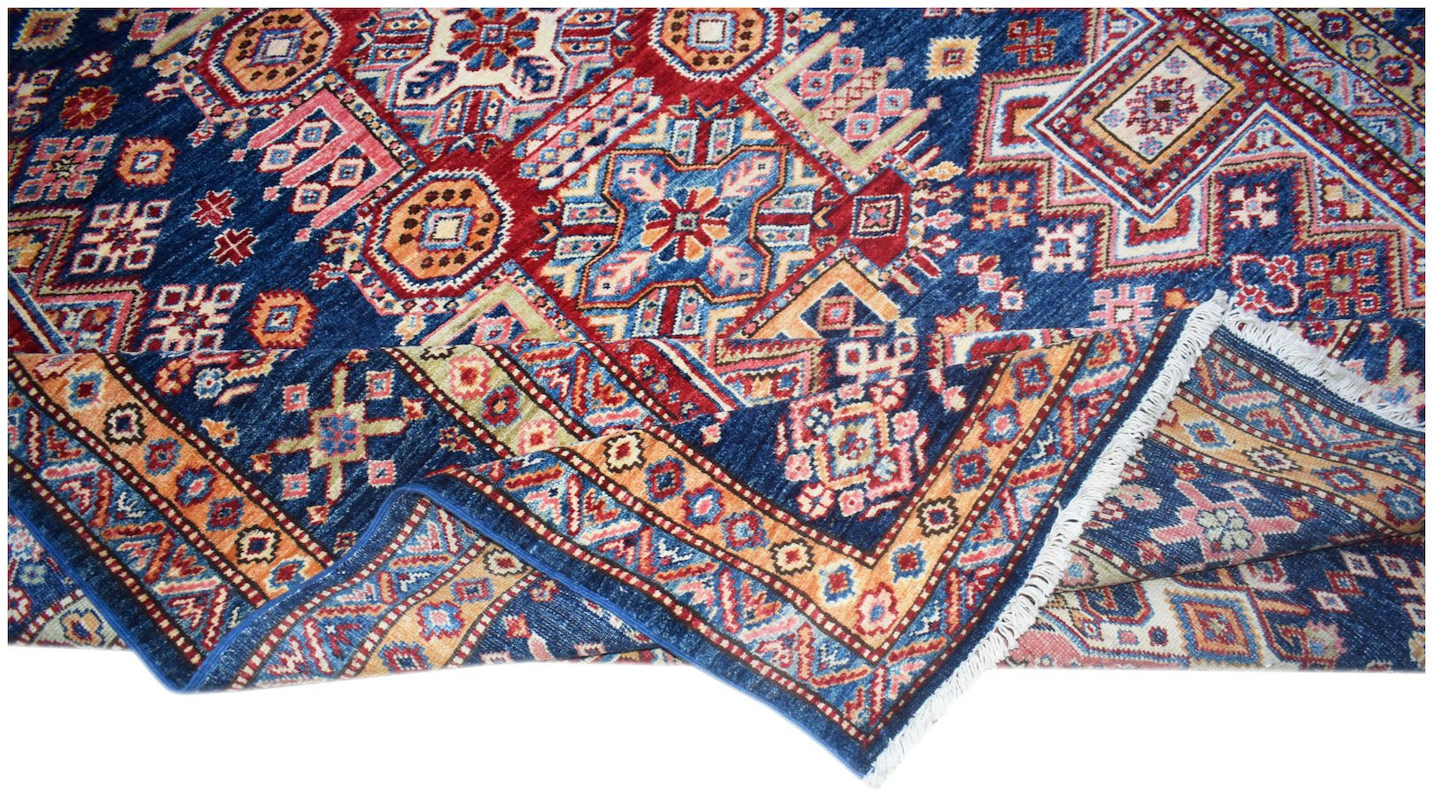A handmade Afghan Super Kazakh rug featuring traditional geometric motifs in blue, red, and gold.