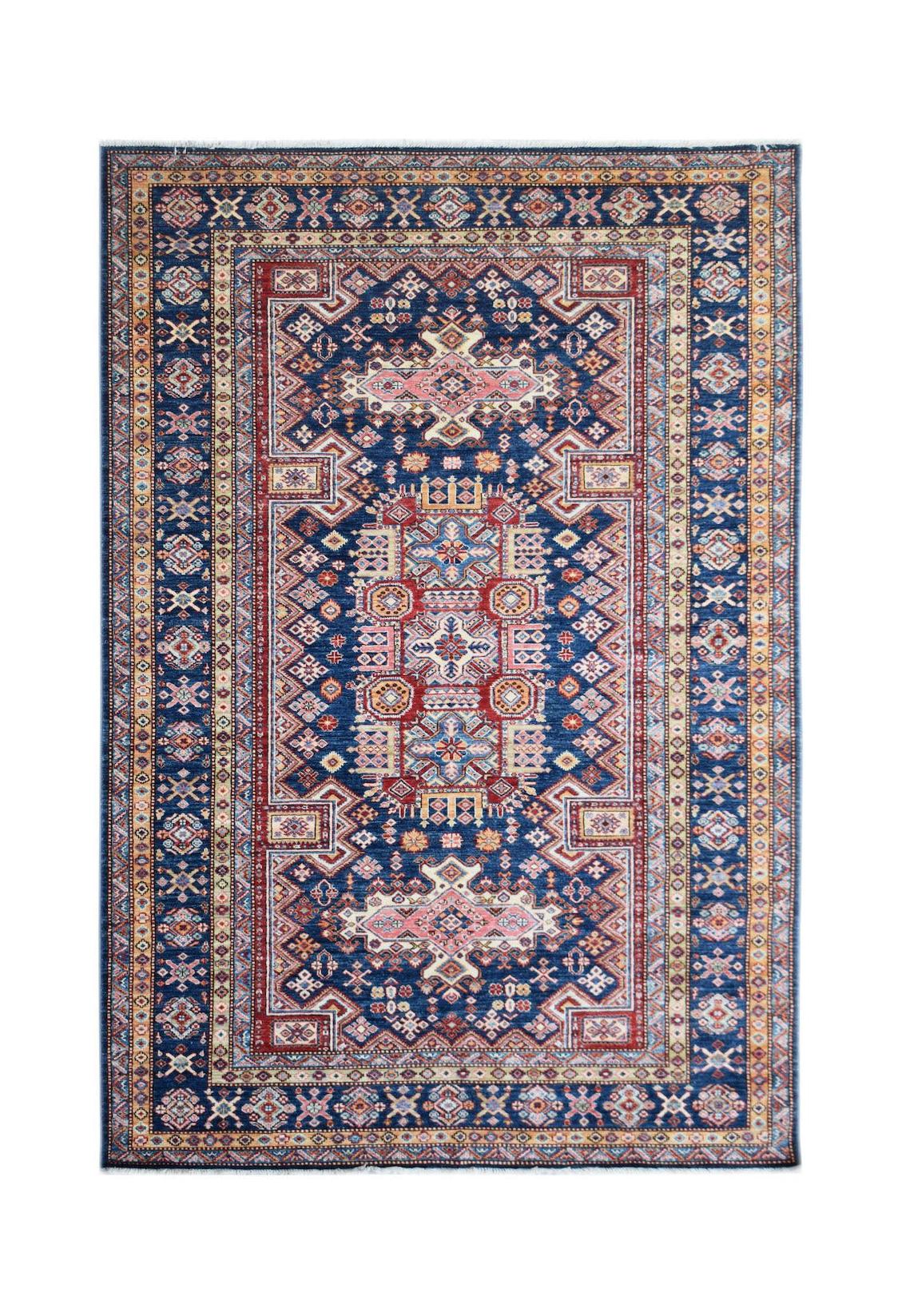 A rectangular Afghan Super Kazakh rug featuring traditional geometric motifs in blue and red.