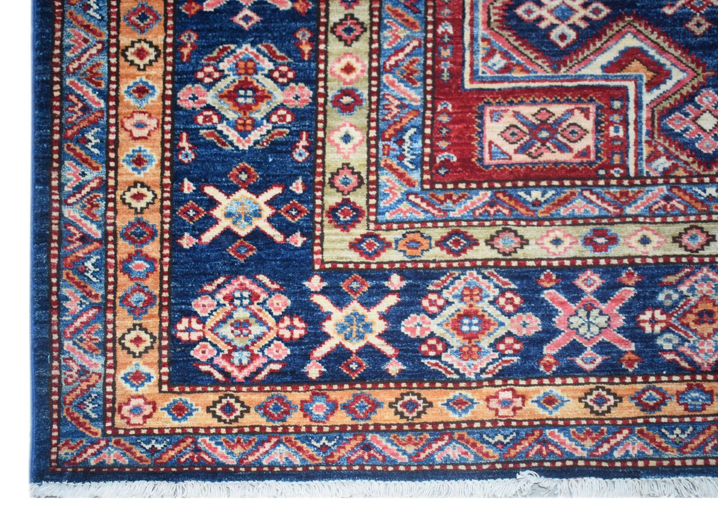 A handmade Afghan Super Kazakh rug featuring traditional geometric motifs in blue, red, and orange.