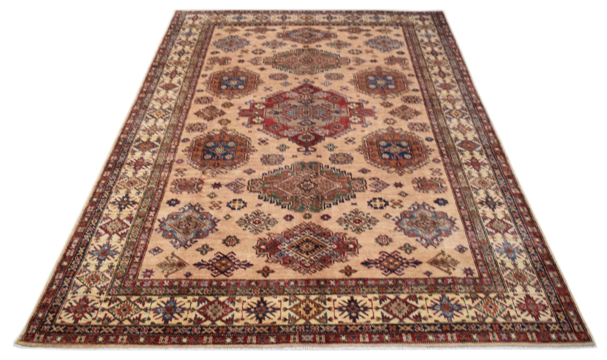 A handmade Afghan Super Kazakh rug featuring traditional geometric motifs in red, blue, and tan.