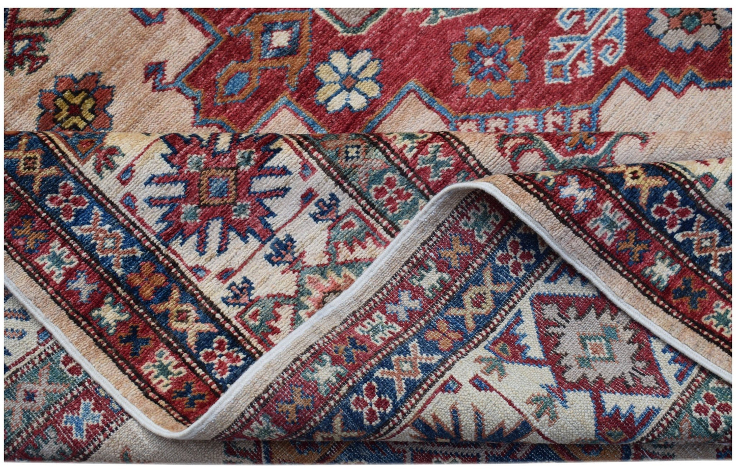 A handmade Afghan Super Kazakh rug featuring traditional geometric motifs in red, blue, and cream.