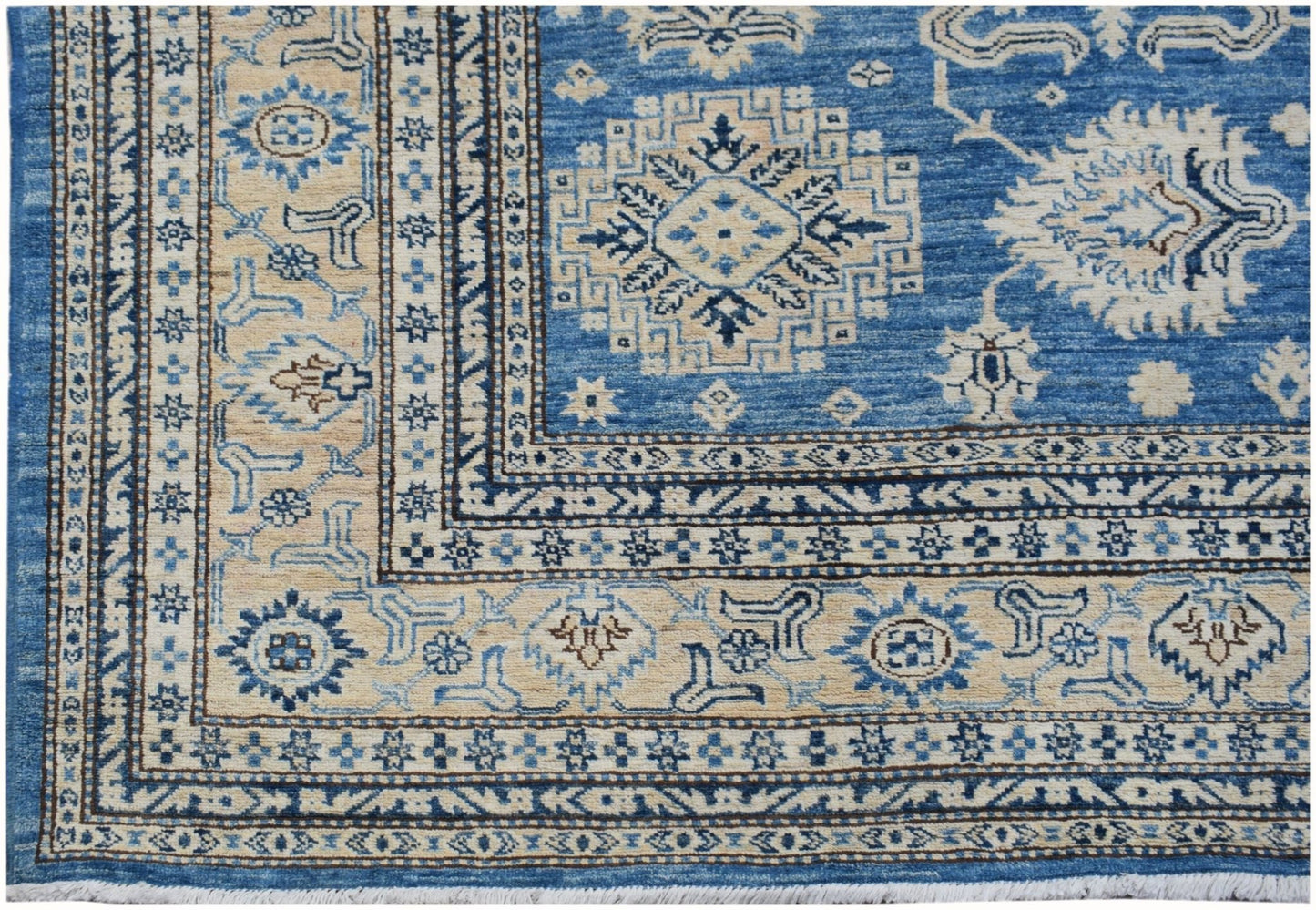 Handmade Afghan Super Kazakh rug featuring traditional geometric motifs in blue and cream tones.
