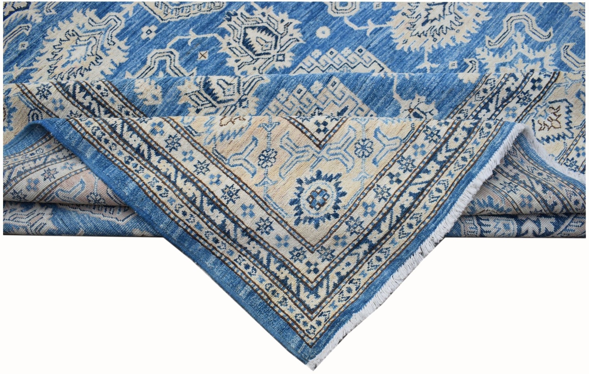 A handmade Afghan Super Kazakh rug featuring traditional blue and cream geometric patterns.