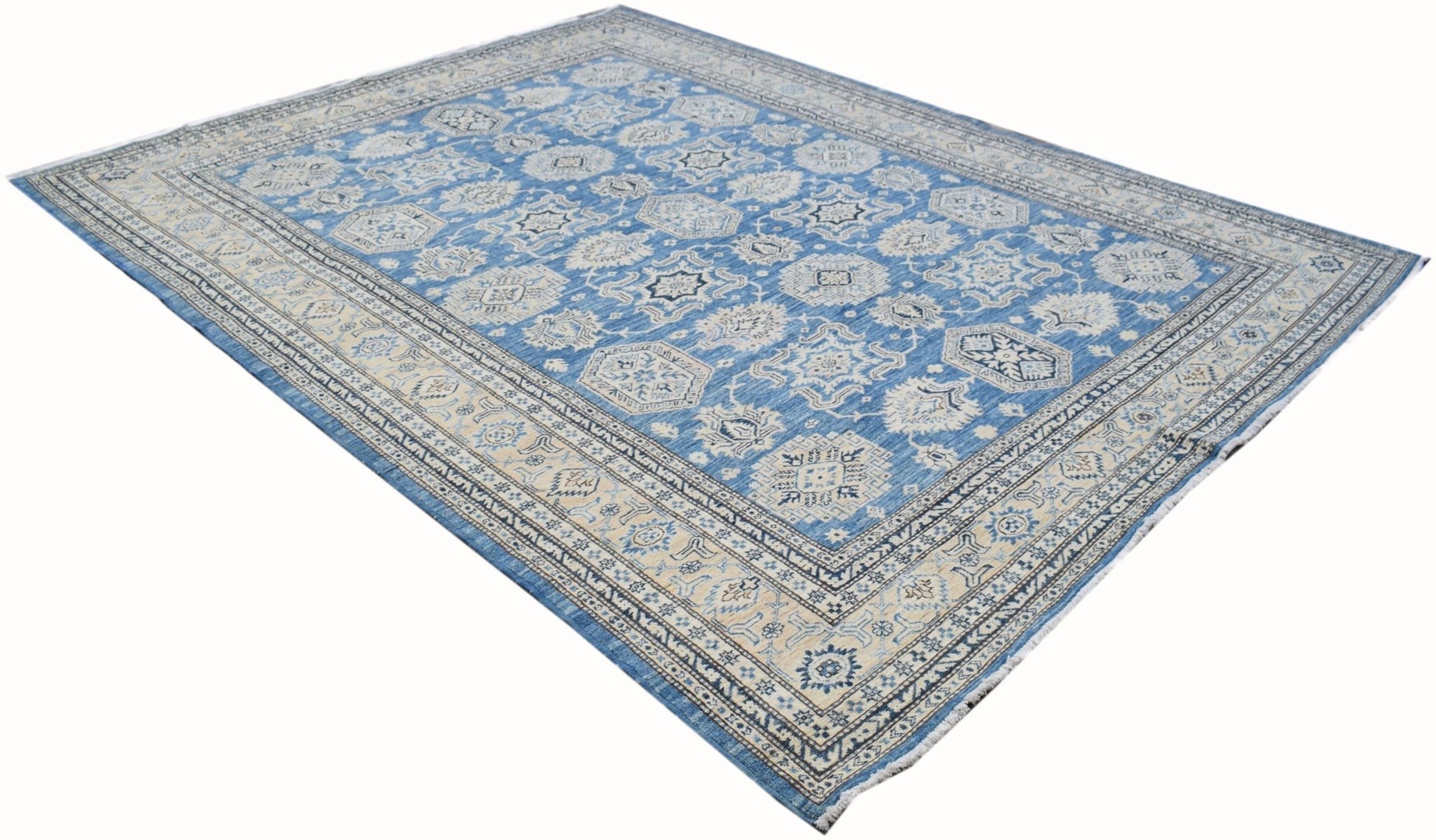 A handmade Afghan Super Kazakh rug featuring traditional geometric motifs in blue and cream tones.