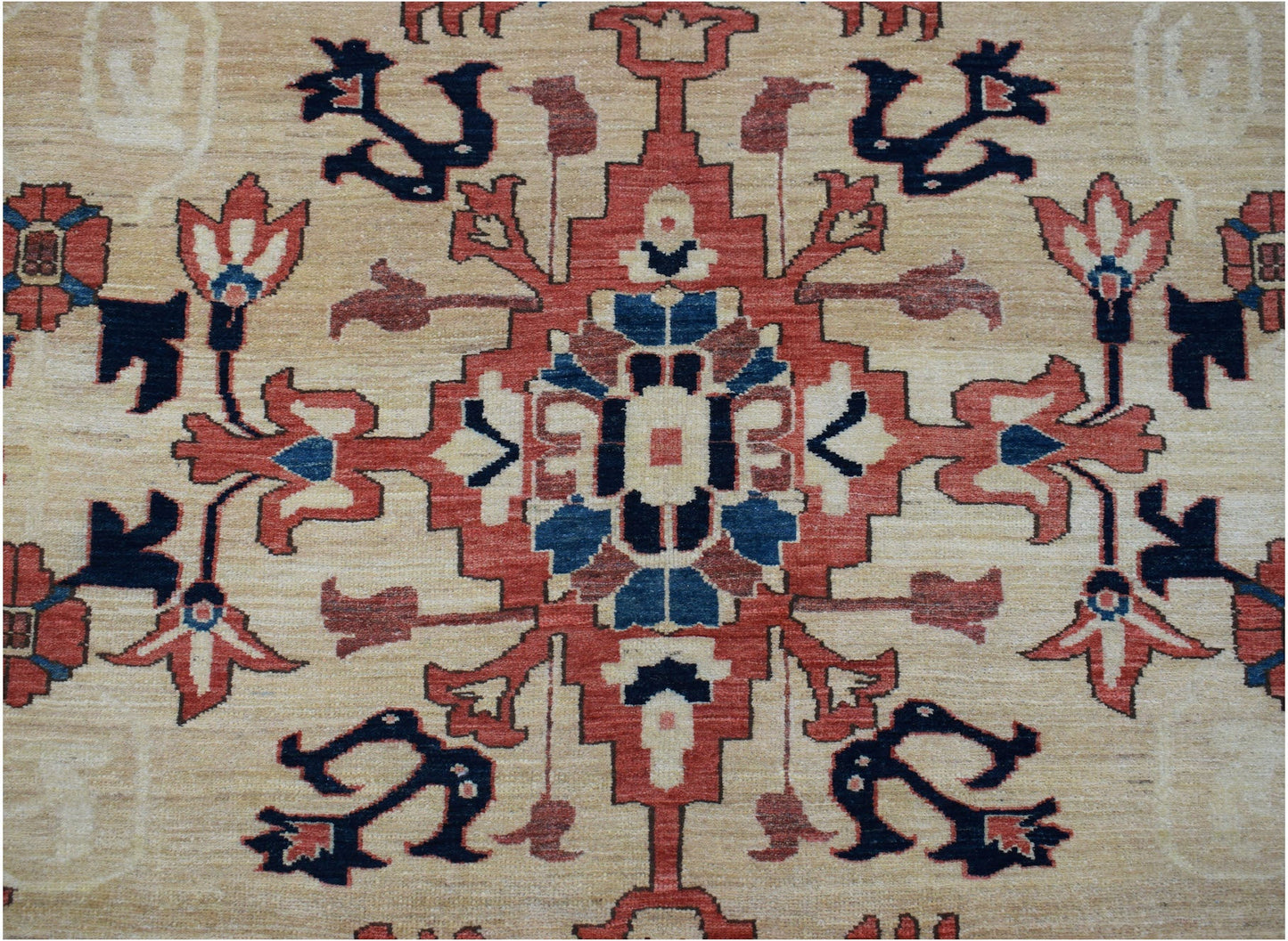 Handmade Afghan Super Kazakh rug featuring a traditional geometric medallion in red, blue, and tan.