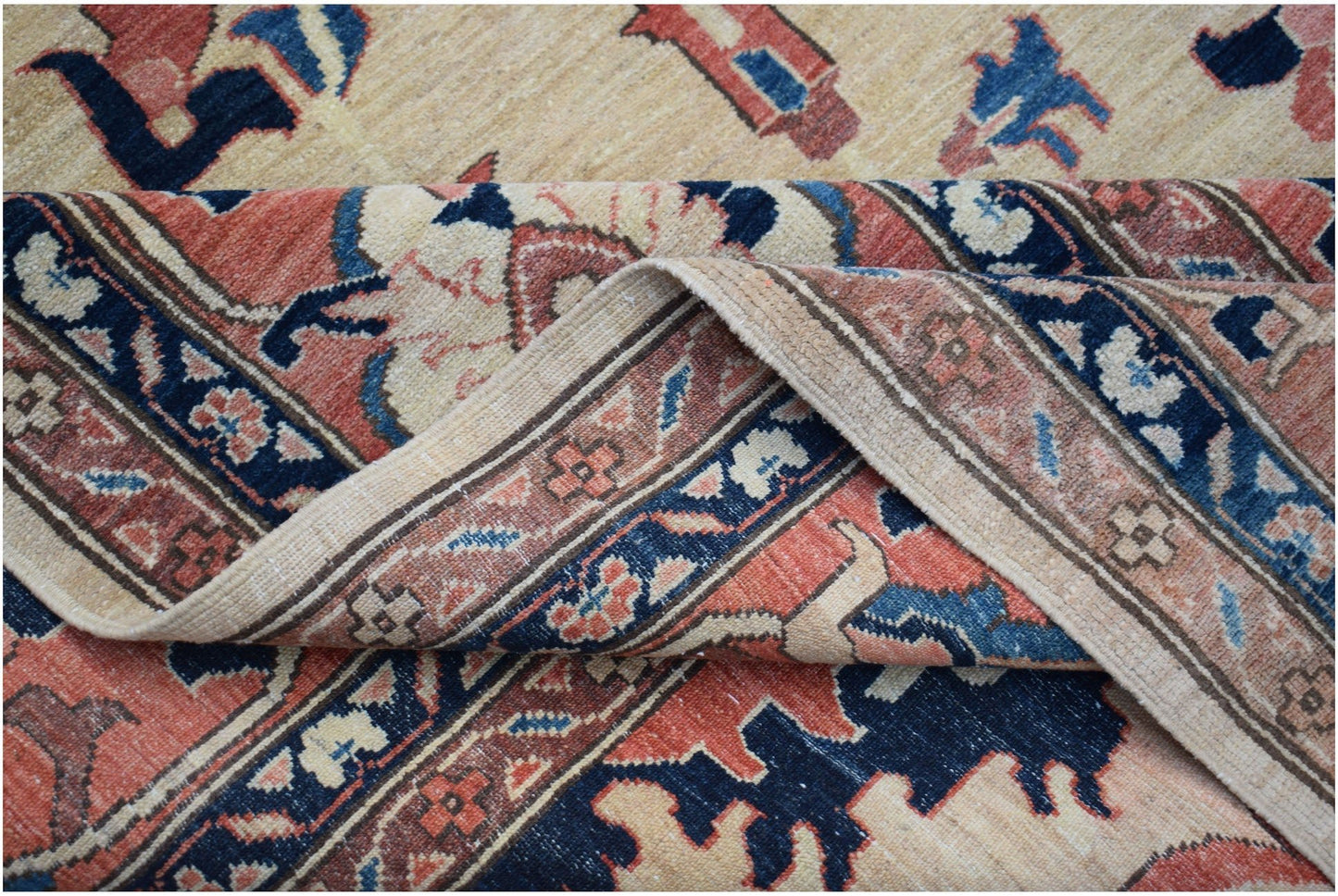 A handmade Afghan Super Kazakh rug featuring traditional geometric motifs in red, blue, and beige.