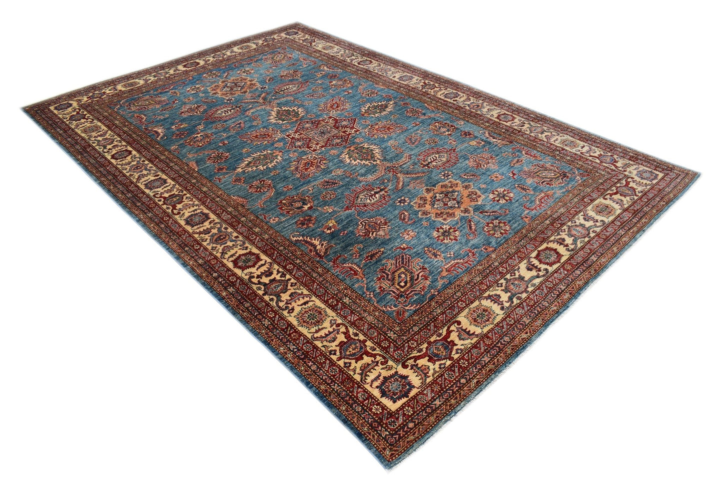 A handmade Afghan Super Kazakh rug featuring traditional geometric motifs in blue, red, and cream.