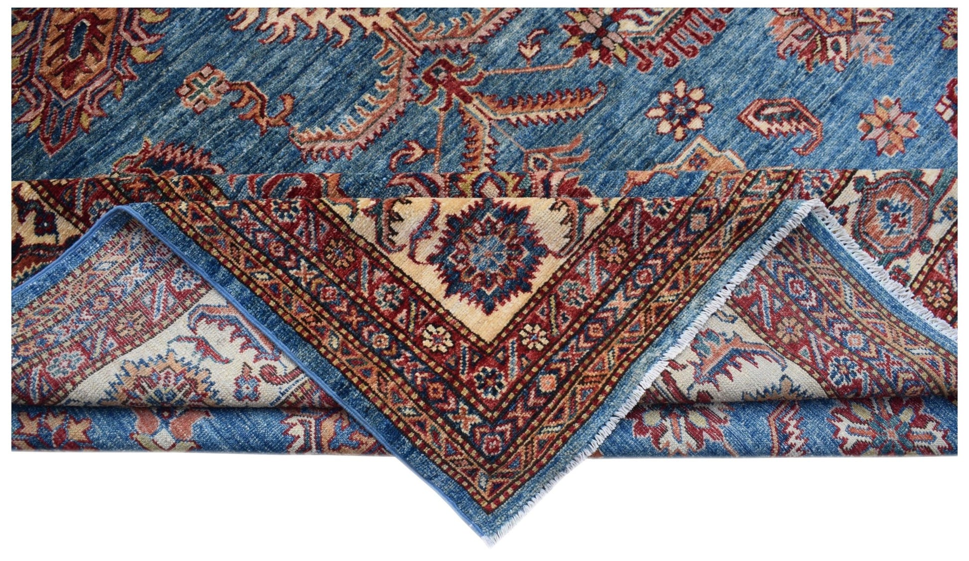 A handmade Afghan Super Kazakh rug featuring traditional blue, red, and cream geometric patterns.
